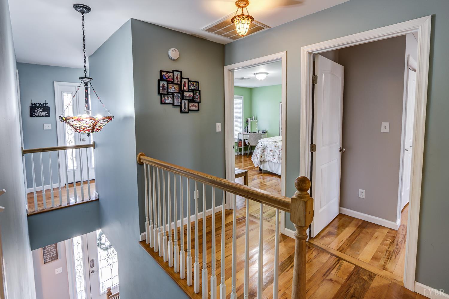 2487 Cifax Road Goode, VA 24556 - Photo 29 of 71 a view of hallway with stairs and wooden floor