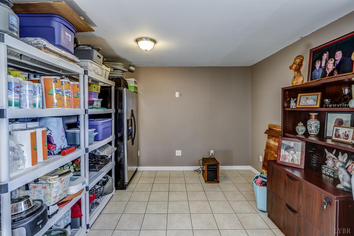 2487 Cifax Road Goode, VA 24556 - Photo 30 of 71 a view of walk in closet with clothes and shoes