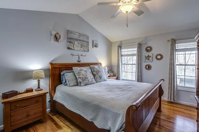 an empty room with a window and wooden floor