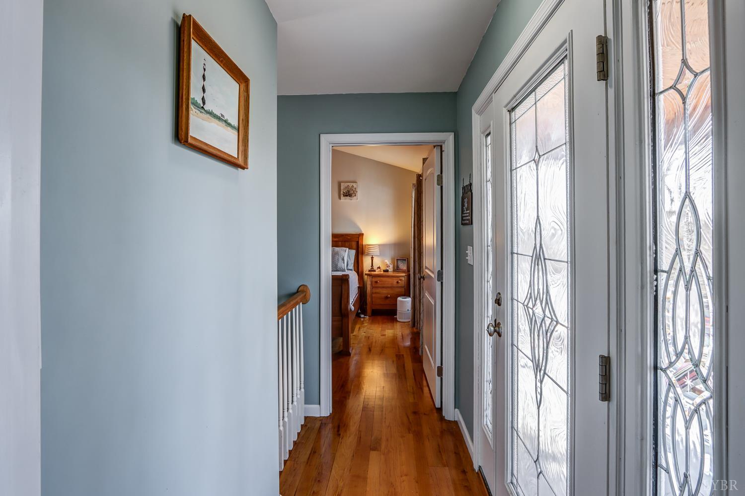 2487 Cifax Road Goode, VA 24556 - Photo 35 of 67 a view of a hallway with wooden floor and living room