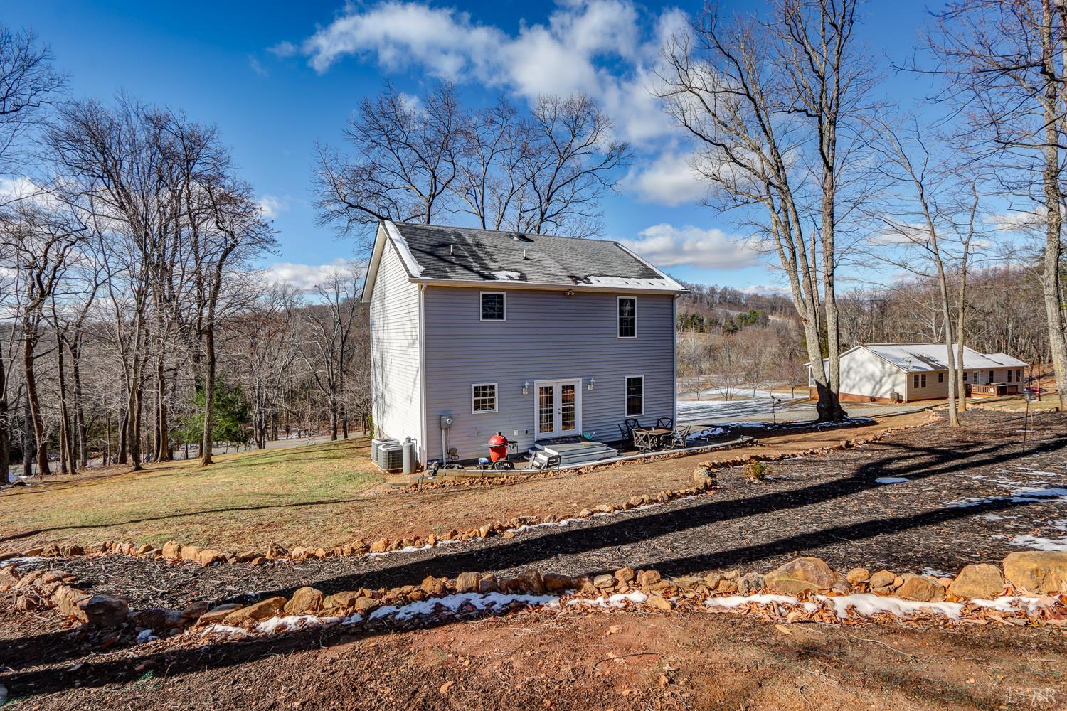 2487 Cifax Road Goode, VA 24556 - Photo 36 of 71 a front view of a house with a yard