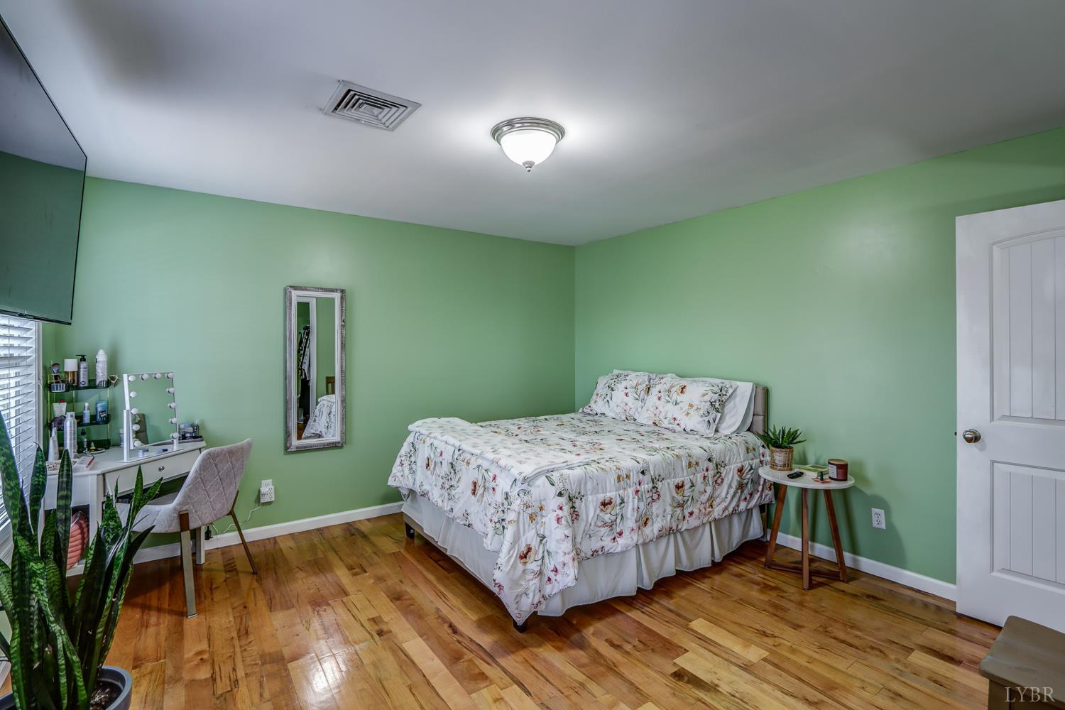 2487 Cifax Road Goode, VA 24556 - Photo 41 of 67 a bedroom with a bed and a table in it