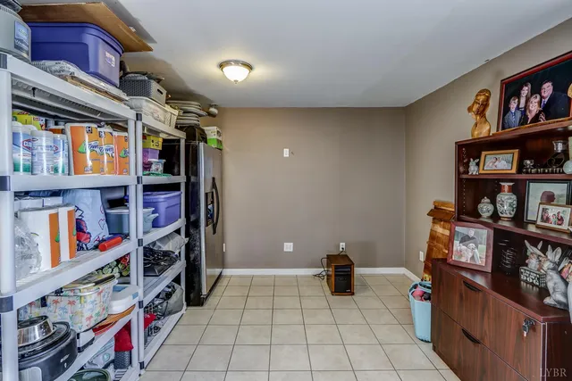 a view of a wooden bench sitting in the middle of a road