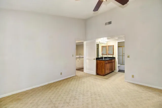 a kitchen with granite countertop a sink and stainless steel appliances