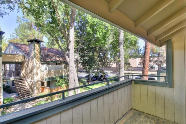 a kitchen with a sink and large window
