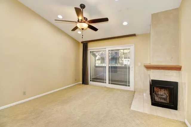 a view of an empty room with a fireplace