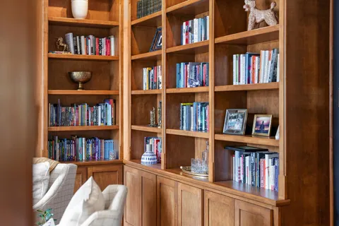 a bathroom with a tub a sink a mirror and a shower