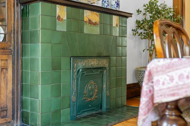a bathroom with a toilet and a mirror