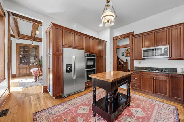 a view of a house with patio and wooden floor