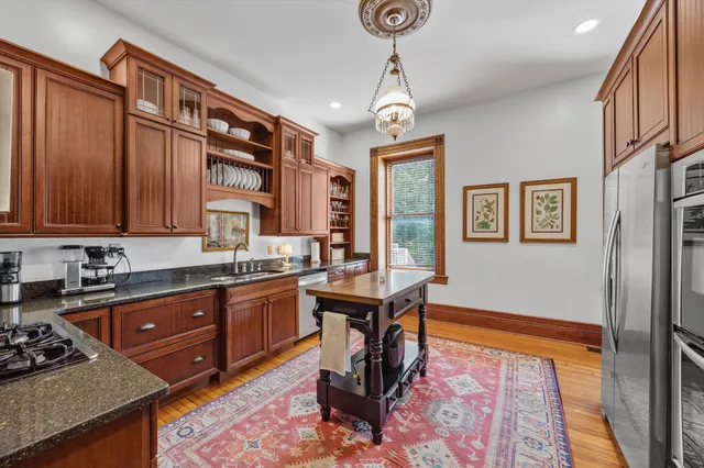 a living room with furniture and large windows