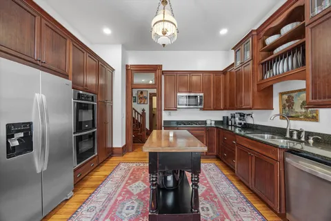 a view of balcony with furniture and wooden floor