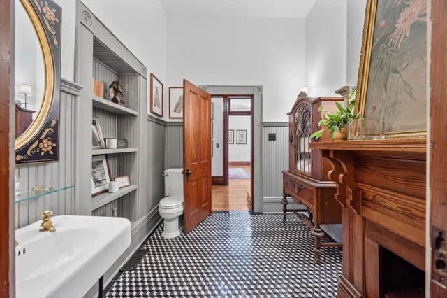 a aerial view of a house with a yard and potted plants