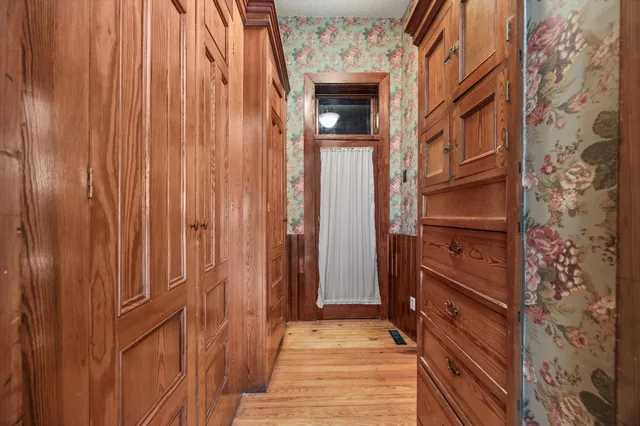 an aerial view of residential house with outdoor space and trees
