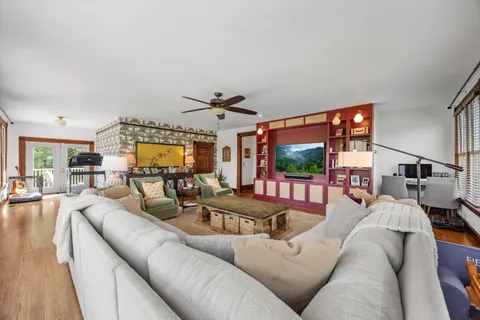a view of a chairs and tables in the balcony