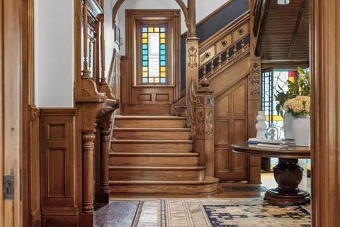 a living room with furniture or couch and a chandelier