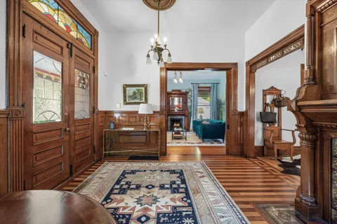 a living room with furniture a window and a flat screen tv