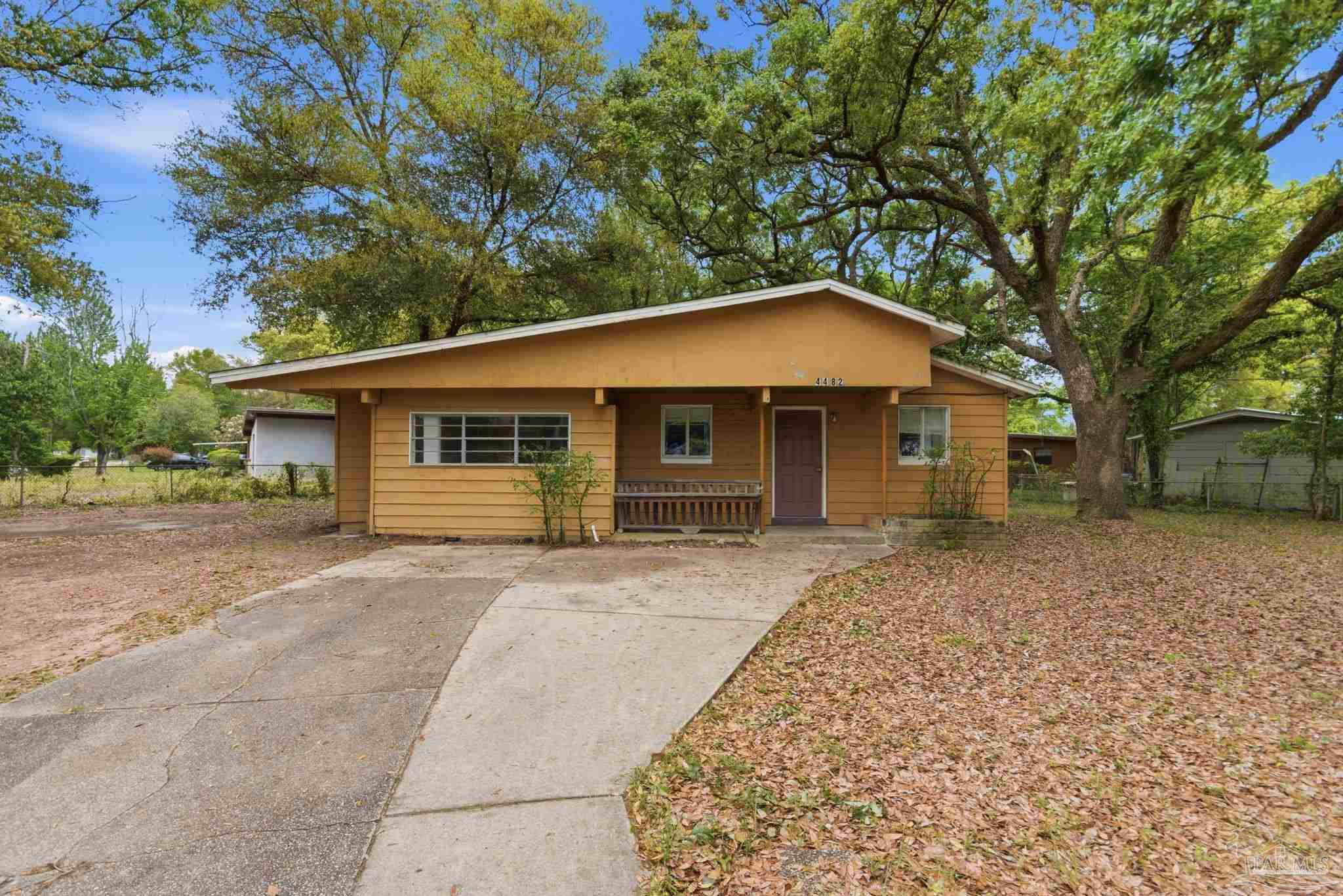 front view of a house with a yard