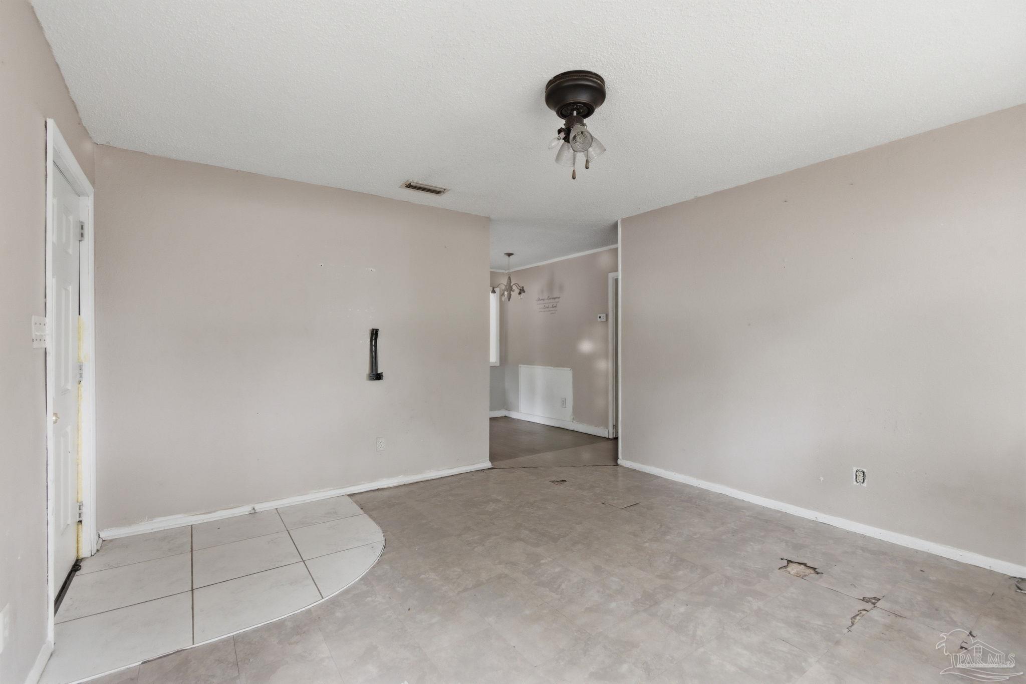 4482 Rochelle Drive Pensacola, FL 32505 - Photo 16 of 30 a view of an empty room and a ceiling fan