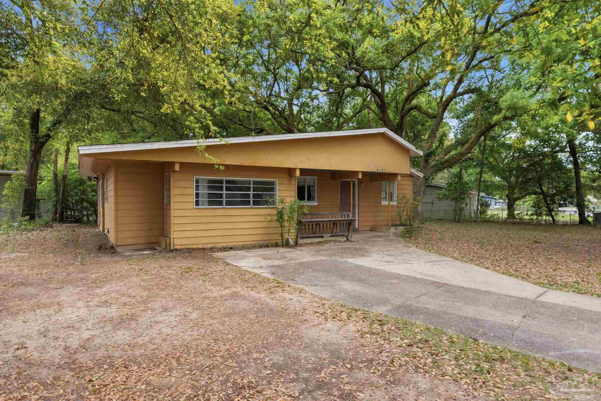 4482 Rochelle Drive Pensacola, FL 32505 - Photo 3 of 30 a house with trees in the background