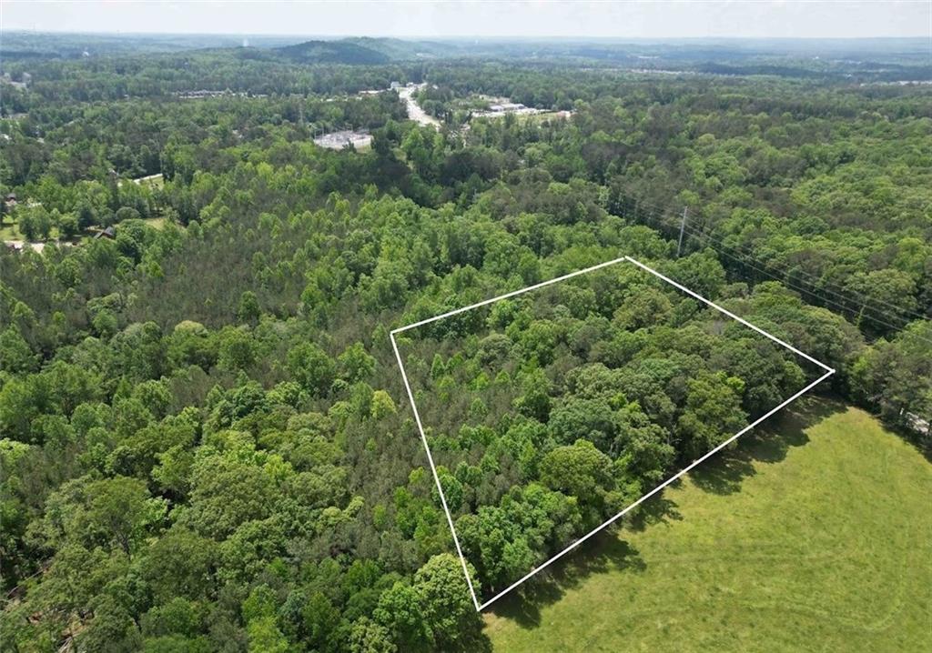 5166 Dallas Acworth Highway Dallas, GA 30132 - Photo 2 of 11 an aerial view of a forest