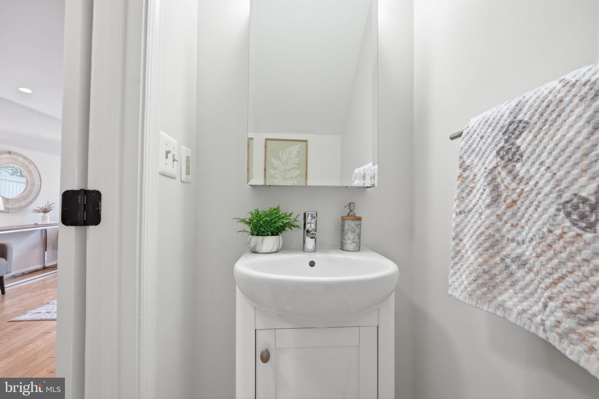 8230 Carrleigh Parkway, Unit 84 Springfield, VA 22152 - Photo 12 of 28 a bathroom with a sink and a mirror