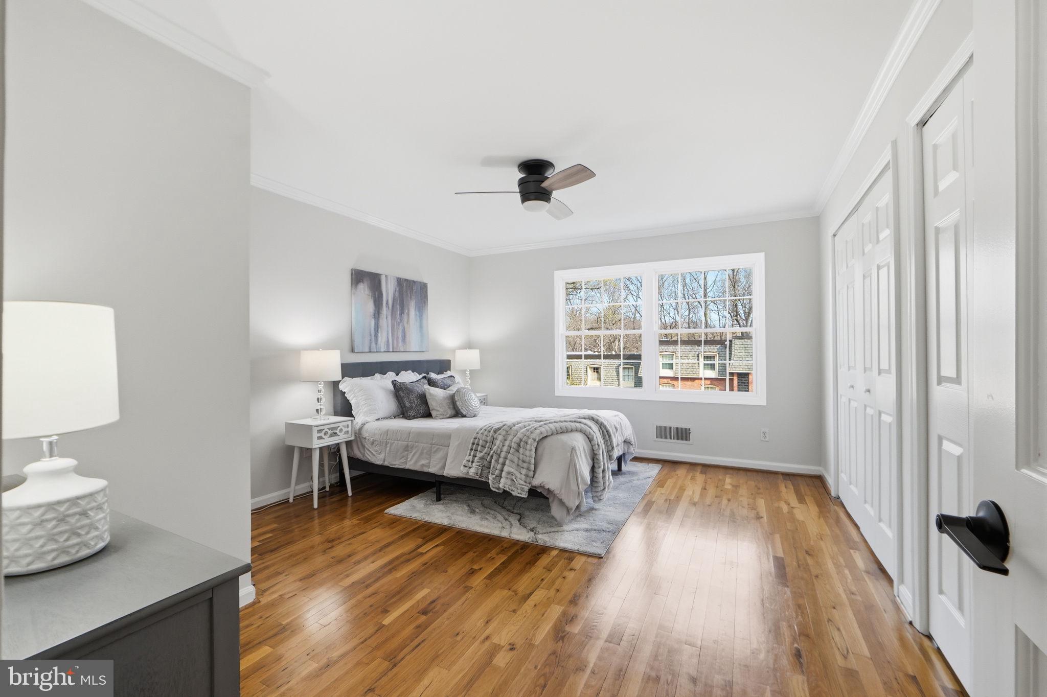 8230 Carrleigh Parkway, Unit 84 Springfield, VA 22152 - Photo 13 of 28 a bed room with a bed and a window