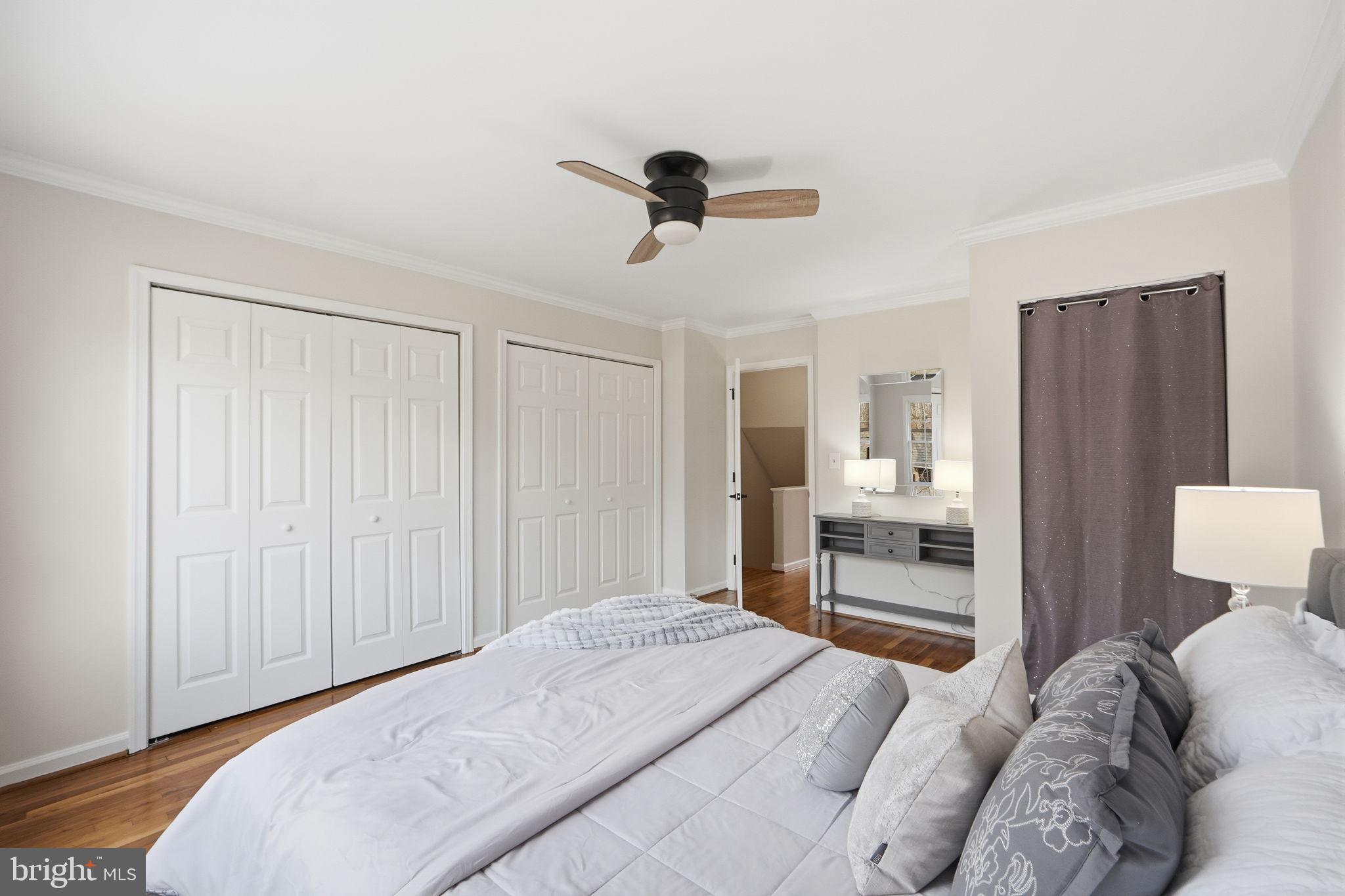 8230 Carrleigh Parkway, Unit 84 Springfield, VA 22152 - Photo 15 of 28 a bedroom with a bed and a dresser