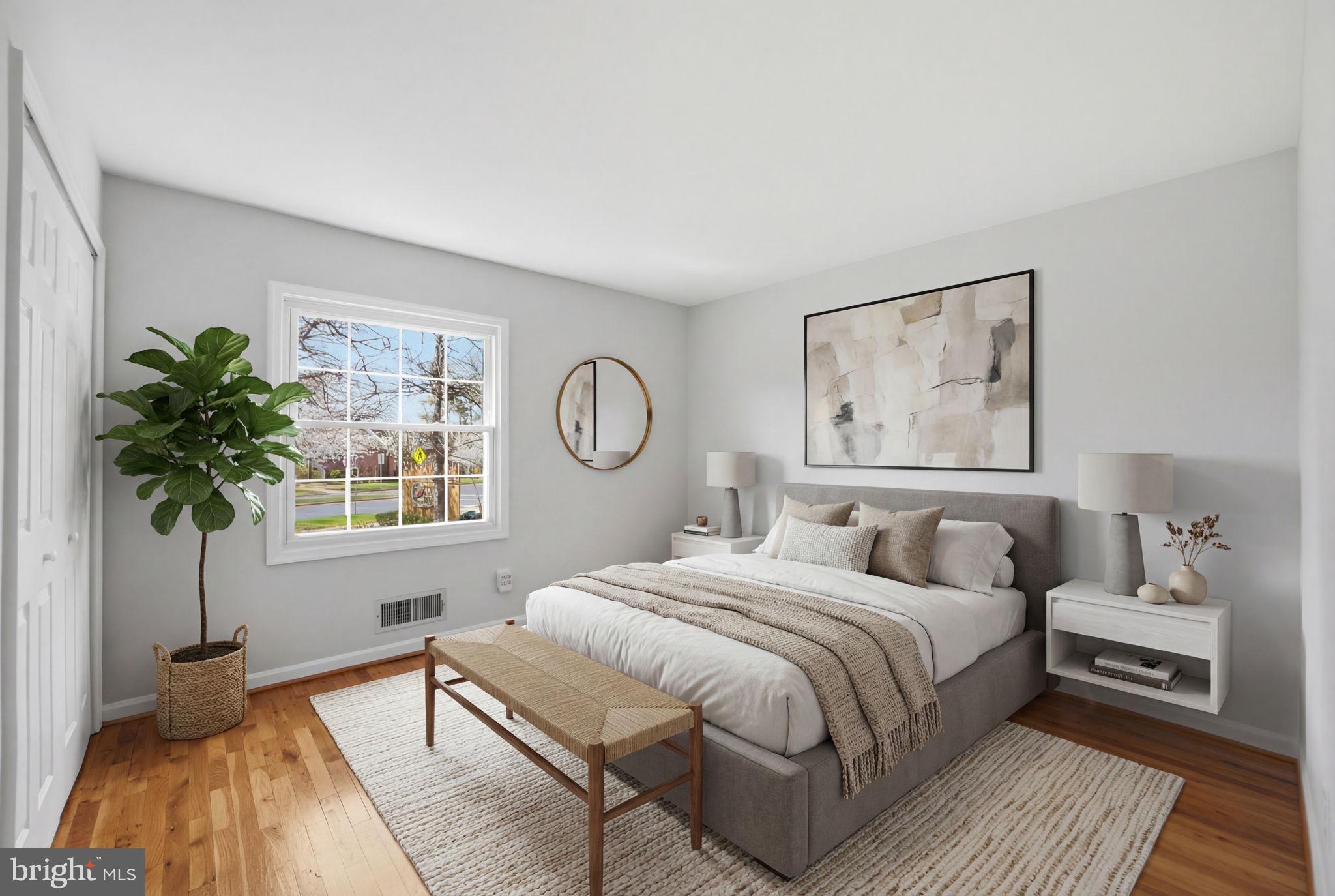 8230 Carrleigh Parkway, Unit 84 Springfield, VA 22152 - Photo 19 of 28 a bedroom with a large bed and a window