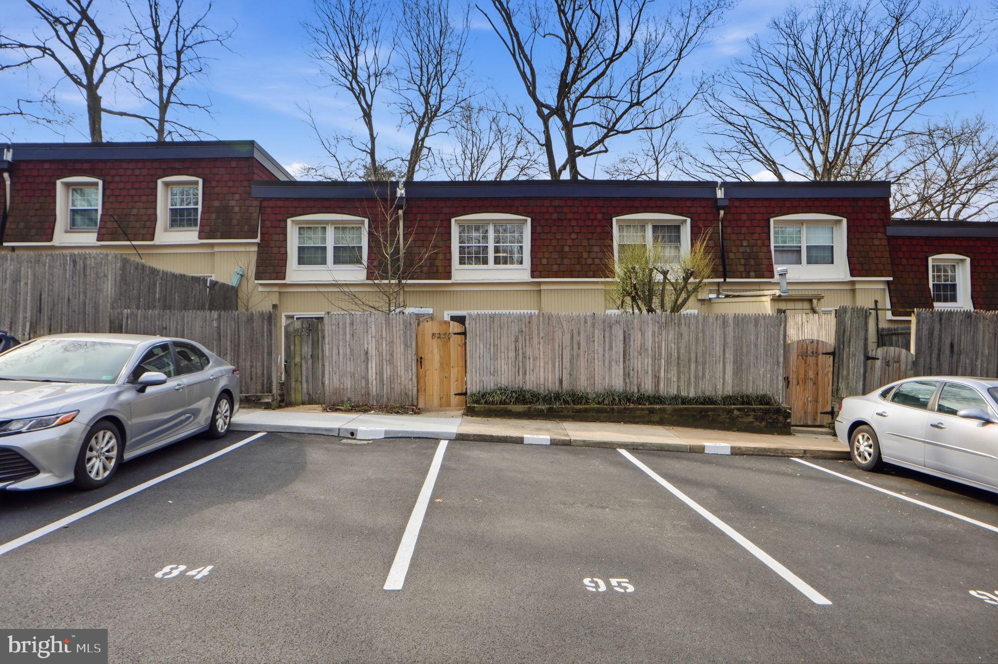 8230 Carrleigh Parkway, Unit 84 Springfield, VA 22152 - Photo 24 of 28 a front view of a house with parking space and parking space