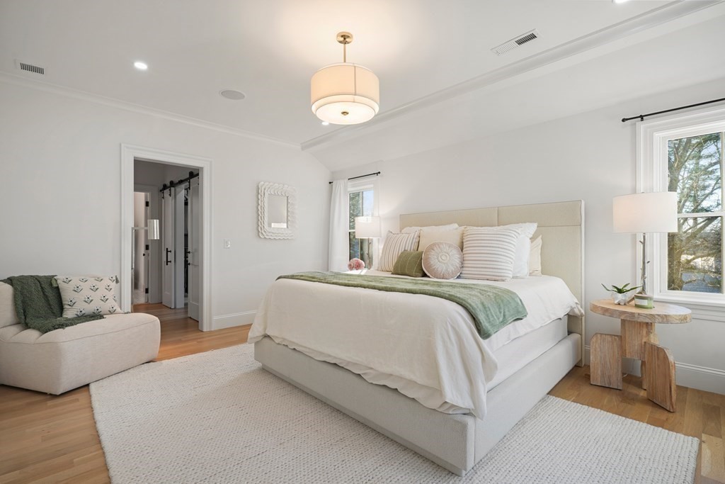 6 Juniper Place Lexington, MA 02420 - Photo 13 of 32 a bedroom with bed and window