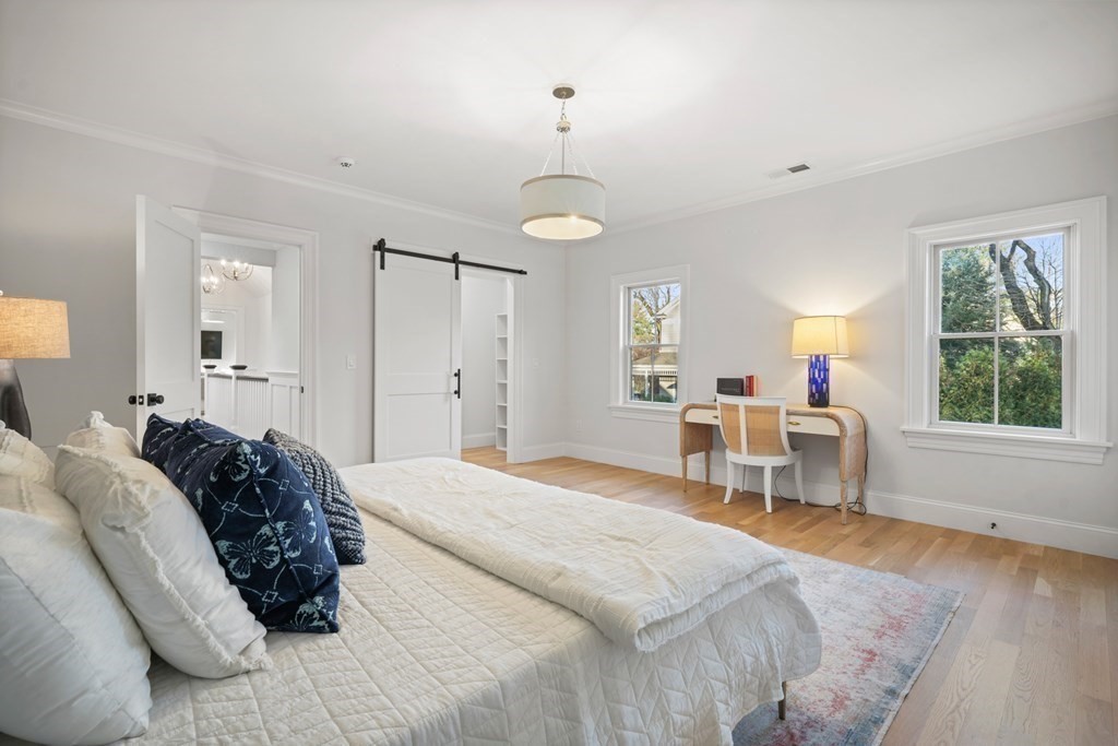 6 Juniper Place Lexington, MA 02420 - Photo 21 of 32 a bed room with a bed and a chair