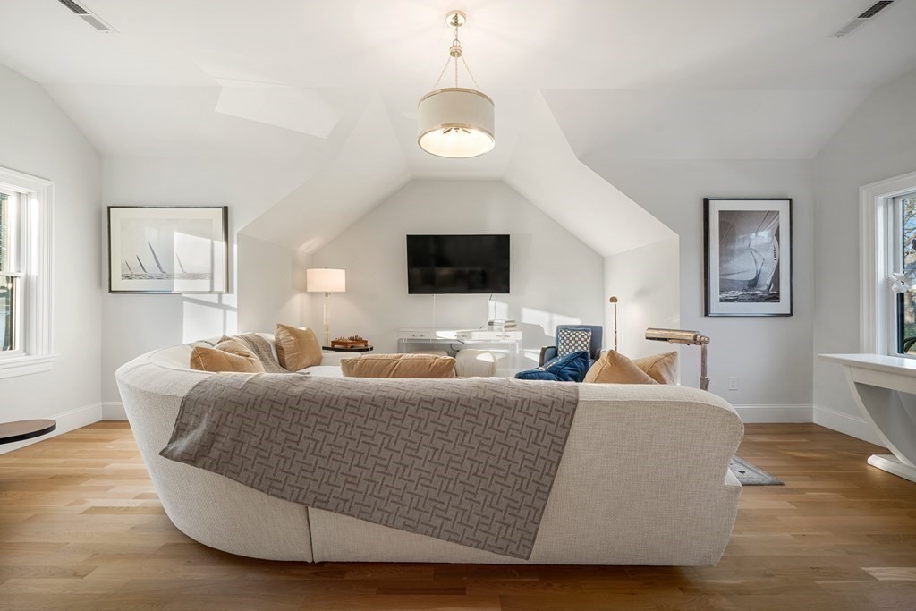 6 Juniper Place Lexington, MA 02420 - Photo 23 of 32 a living room with couches and a flat screen tv