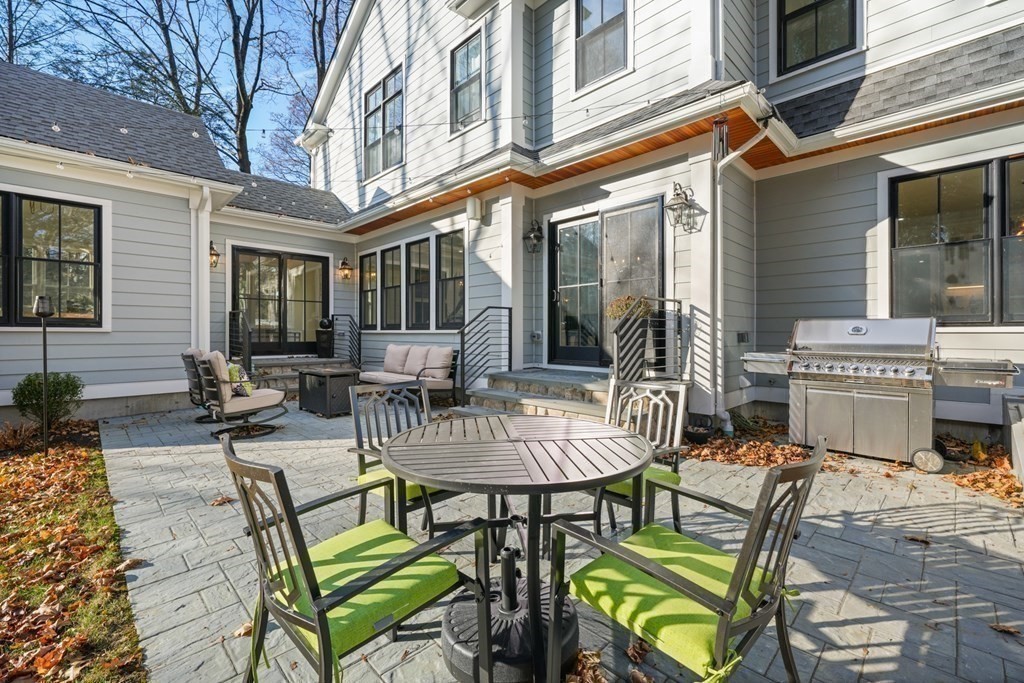 6 Juniper Place Lexington, MA 02420 - Photo 30 of 32 a view of a patio with table and chairs and potted plants