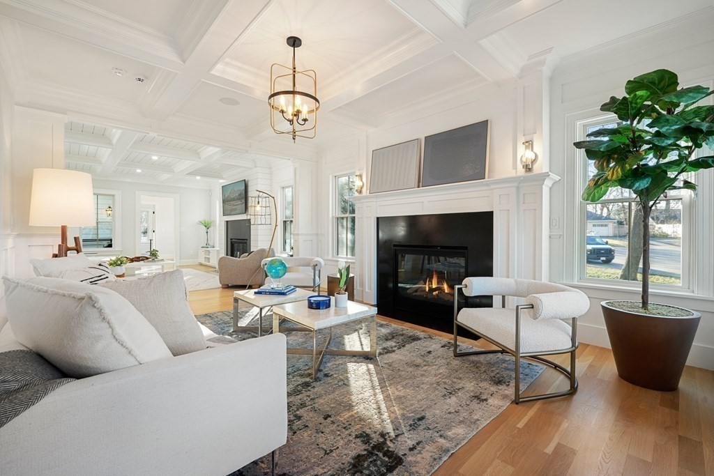 6 Juniper Place Lexington, MA 02420 - Photo 3 of 32 a living room with furniture a fireplace and a chandelier