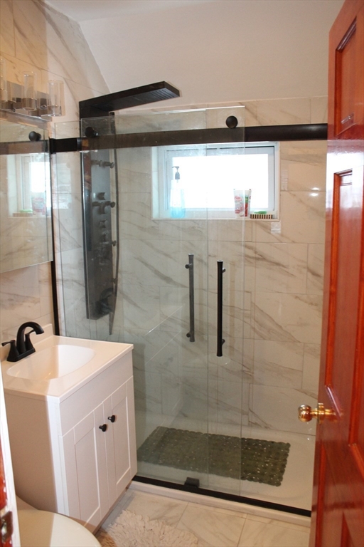618 Harvard Street Boston, MA 02126 - Photo 31 of 42 a bathroom with a bathtub and shower