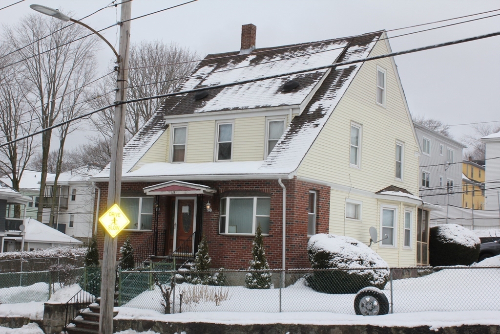 618 Harvard Street Boston, MA 02126 - Photo 4 of 42 a front view of a house with parking
