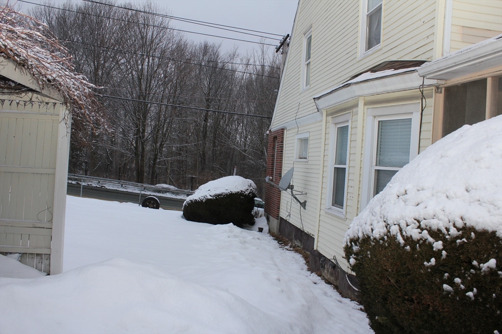 618 Harvard Street Boston, MA 02126 - Photo 41 of 42 a view of a house with a snow on the road