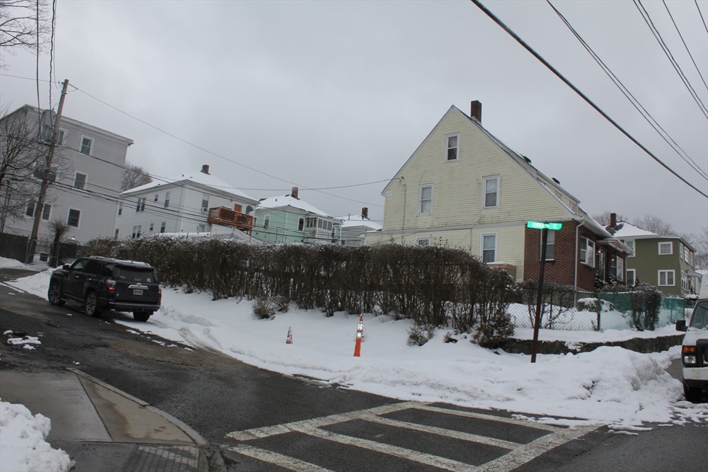 618 Harvard Street Boston, MA 02126 - Photo 6 of 42 a view of a street with cars