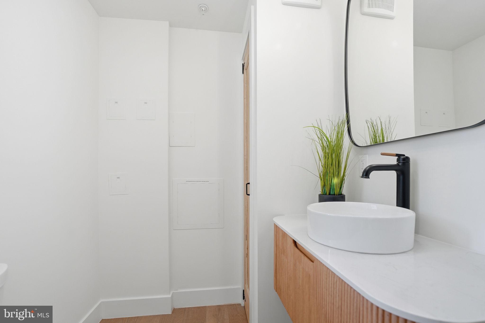 3916 8th Street Northwest, Unit B Washington, DC 20011 - Photo 11 of 24 a bathroom with a sink and a mirror