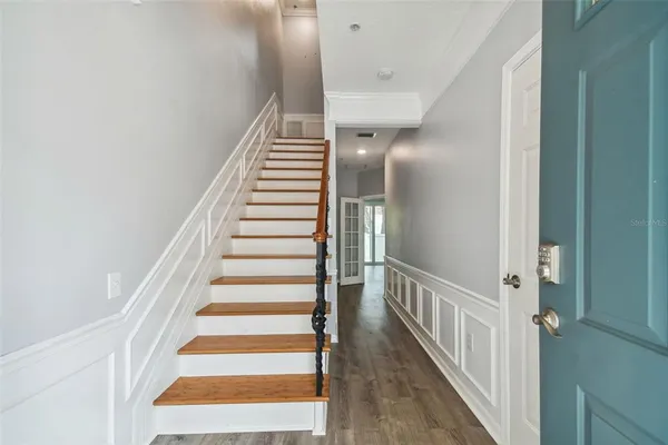 a view of a hallway with stairs