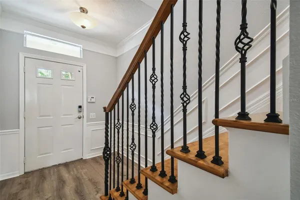 an entryway with a flower pot