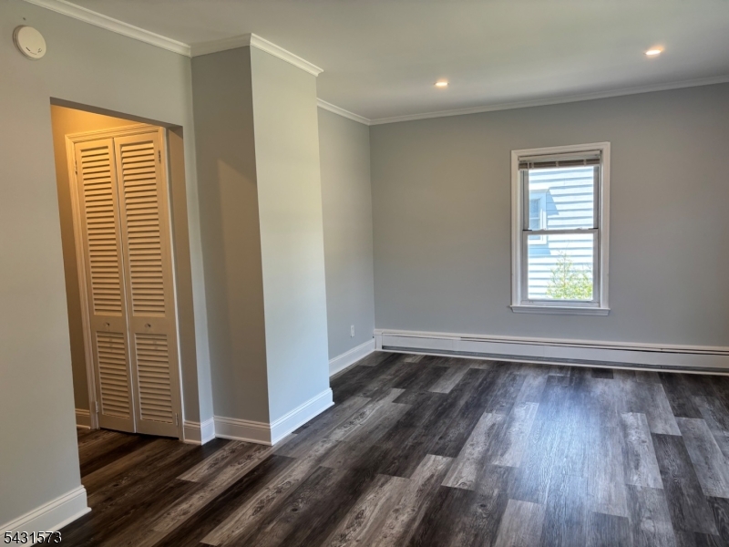 358 Woodland Road, Unit 2 Madison, NJ 07940 - Photo 29 of 50 an empty room with wooden floor and windows