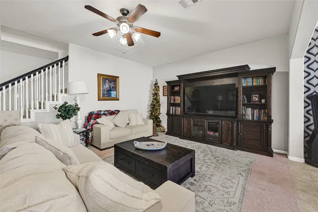 a living room with furniture and a flat screen tv