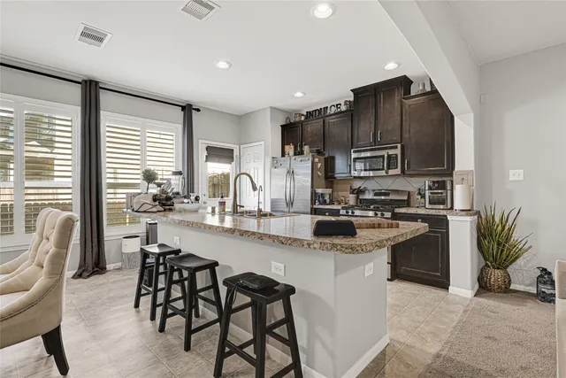 a kitchen with appliances cabinets and a counter top space