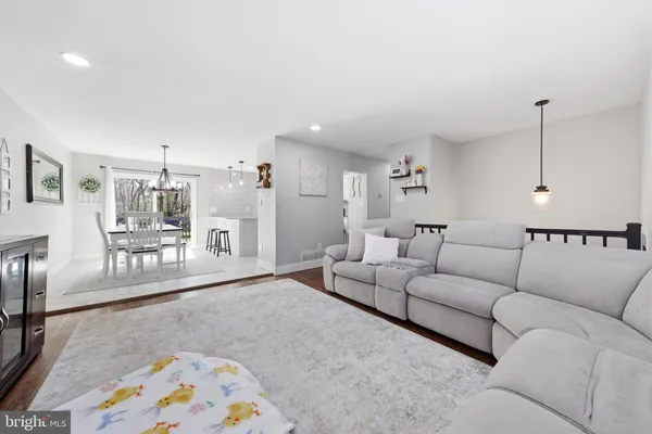 a living room with furniture and a rug