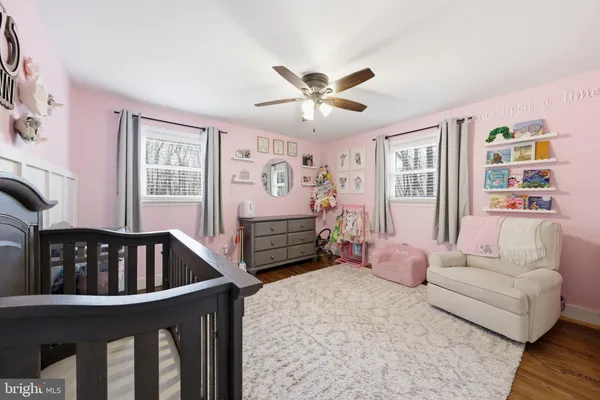 a bedroom with furniture and window