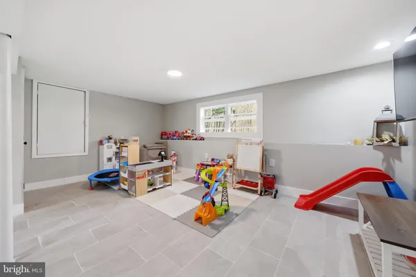 a children room with toys and a couch
