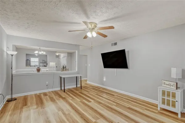 a room with a bed and a flat screen tv
