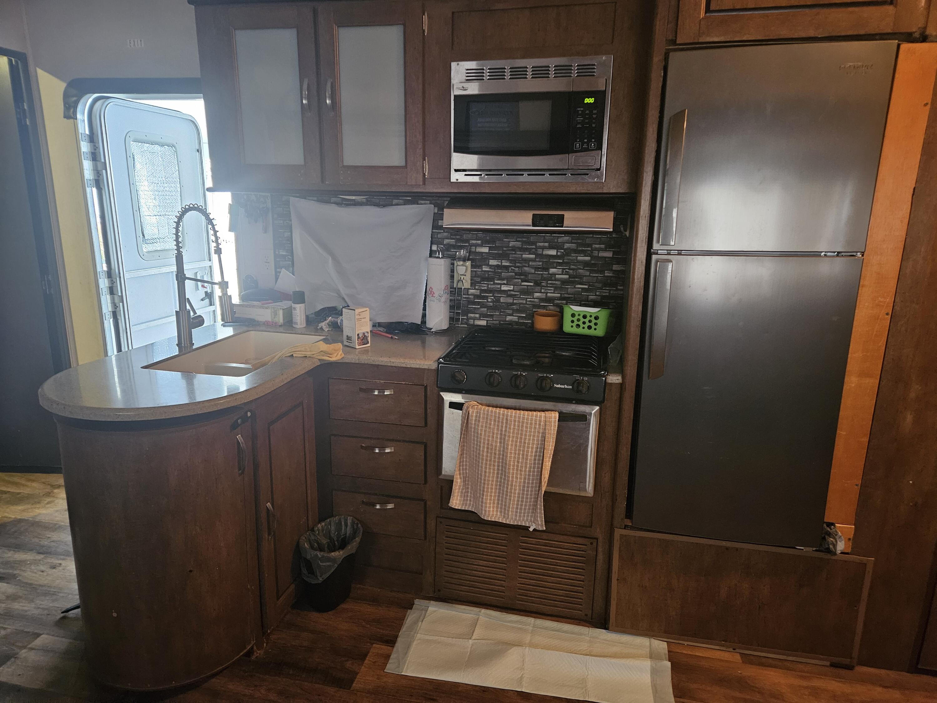 325 Calusa Street, Unit 259 Key Largo, FL 33037 - Photo 12 of 12 a kitchen with a refrigerator and a sink