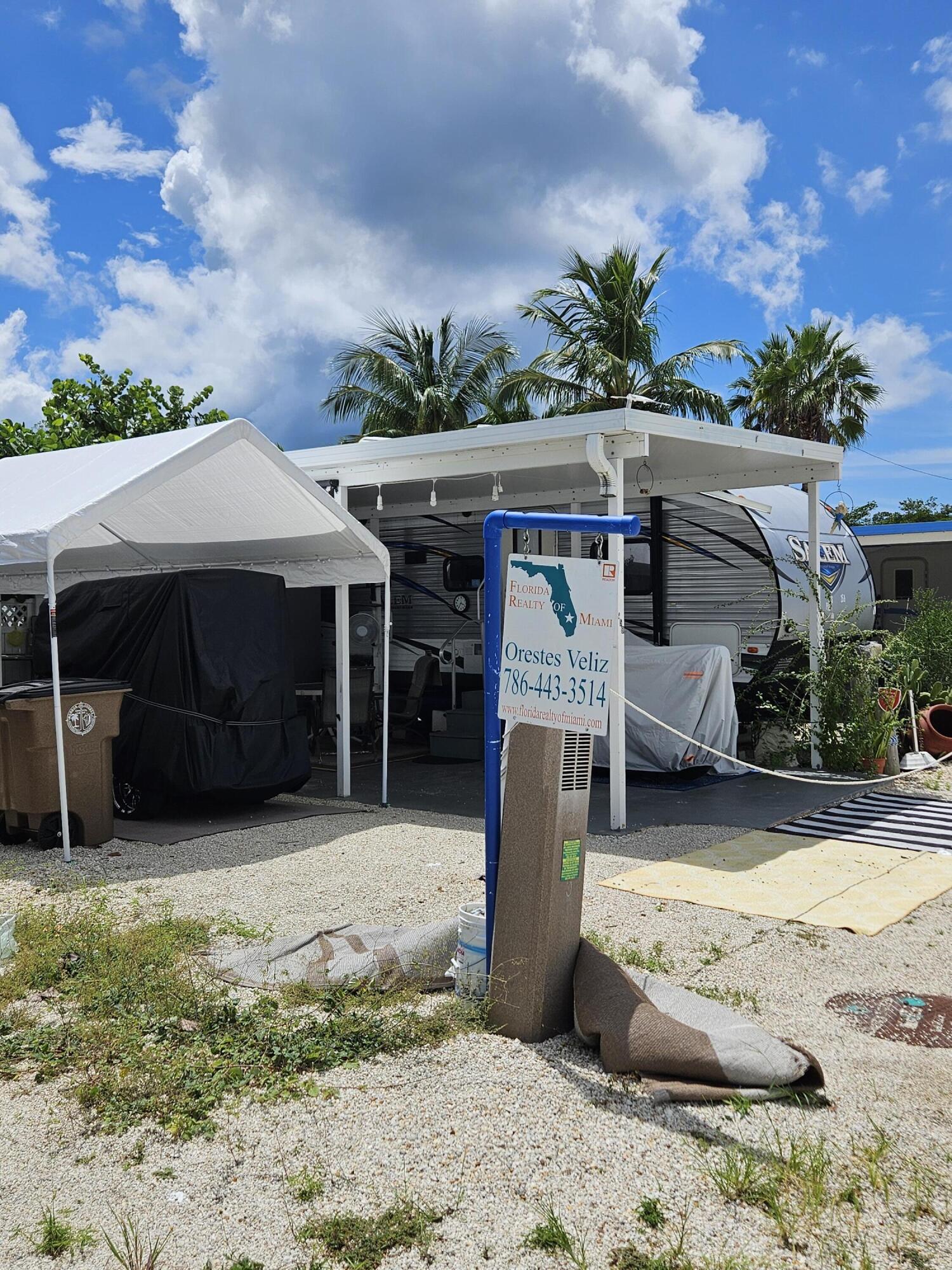 325 Calusa Street, Unit 259 Key Largo, FL 33037 - Photo 6 of 12 a view of a house with a patio